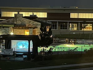 Movie playing on mobile screen at local community pool